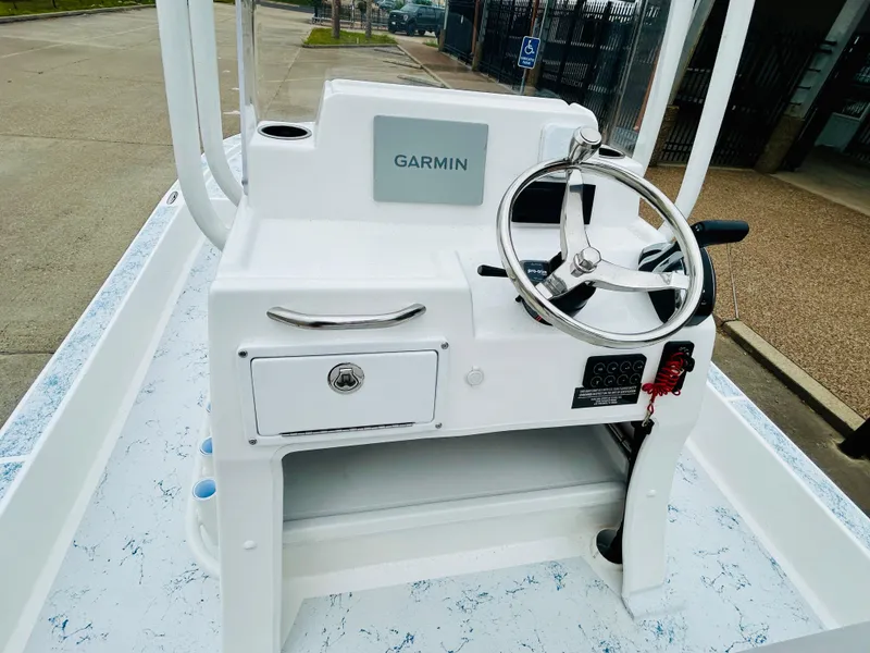 Slide: The Image of 2024 Shallow Sport 18 Sport boat console with Garmin navigation system. - 10