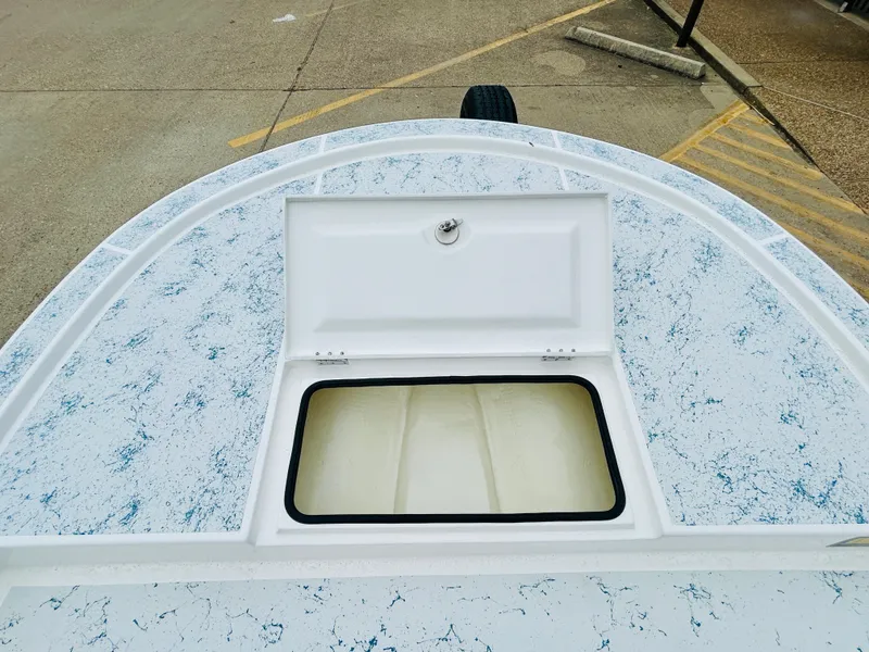 Slide: The Image of 2024 Shallow Sport 18 Sport boat with open storage compartment. - 15