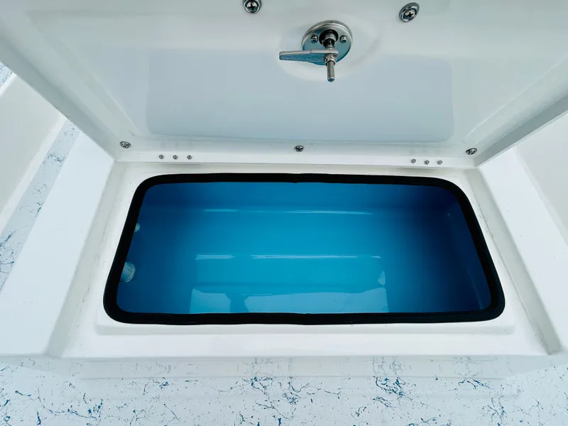 Slide: The Image of Open storage compartment of 2024 Shallow Sport 18 Sport boat. - 17