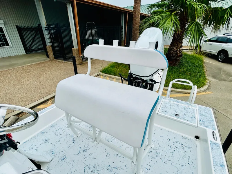 Slide: The Image of 2024 Shallow Sport 18 Sport boat with white seating and console. - 9