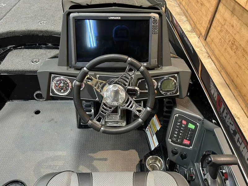Slide: The Image of 2018 Ranger Z520L boat dashboard with Lowrance display and steering wheel. - 5
