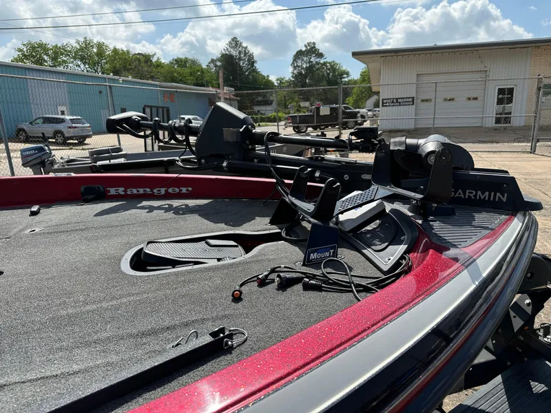 Slide: The Image of 2010 Ranger Z520 Comanche boat with Garmin electronics in a parking lot. - 11
