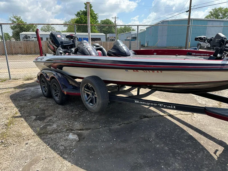 Slide: The Image of 2010 Ranger Z520 Comanche boat on a trailer in a fenced lot. - 12