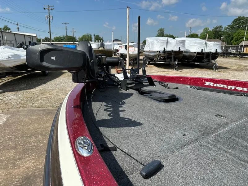 Slide: The Image of 2010 Ranger Z520 Comanche boat deck with trolling motor in a marina. - 15