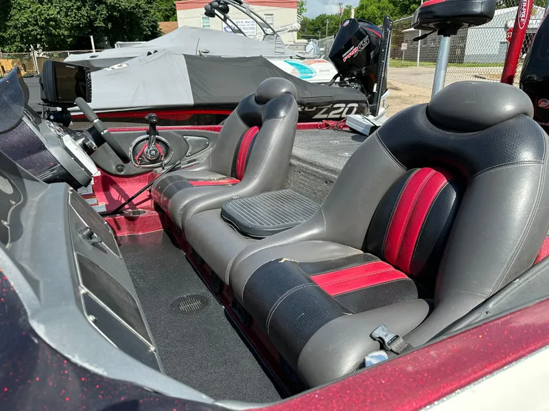 Slide: The Image of 2010 Ranger Z520 Comanche boat interior with dual seats and steering console. - 16