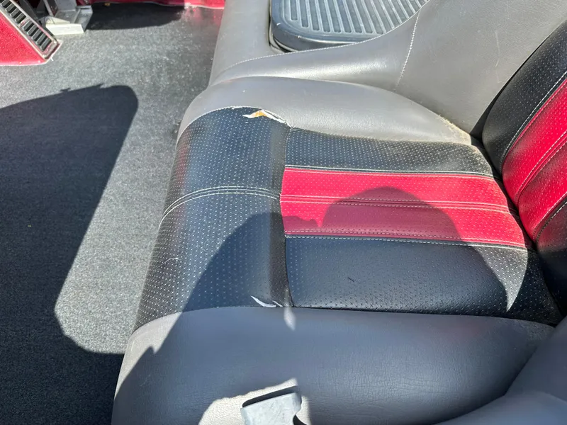 Slide: The Image of 2010 Ranger Z520 Comanche boat seat with minor wear and tear. - 17