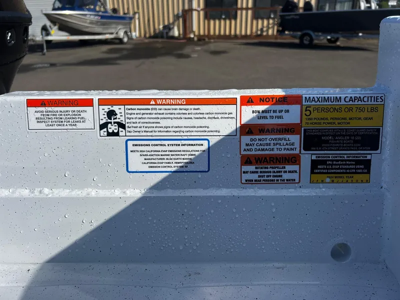 Slide: The Image of 2024 Fish Rite Angler 18 warning and capacity labels on boat interior. - 13
