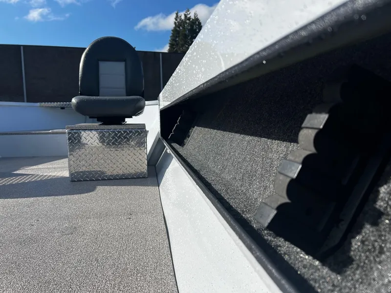 Slide: The Image of 2024 Fish Rite Angler 18 boat interior with seating and storage compartments. - 14