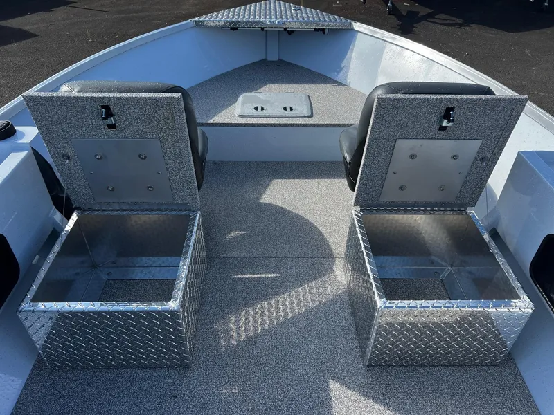 Slide: The Image of 2024 Fish Rite Angler 18 boat interior with two seats and storage compartments. - 16