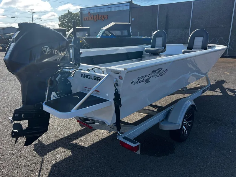 Slide: The Image of 2024 Fish Rite Angler 18 boat with Tohatsu outboard motor on trailer. - 6