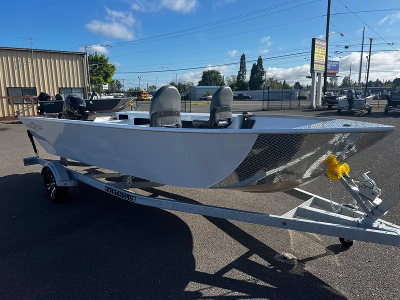 Slide: The Image of 2024 Fish Rite Angler 18 boat on trailer in outdoor lot. - 8