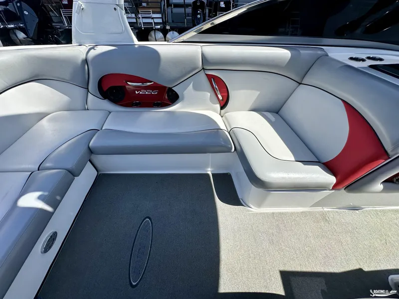Slide: The Image of 2013 Supreme V226 boat interior with gray and red seating. - 9