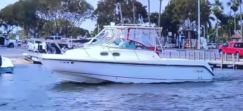 The Image of 2000 Boston Whaler 28 Conquest boat docked at a marina. - 0