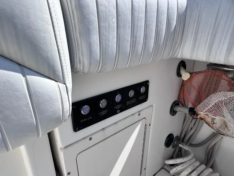 Slide: The Image of Control panel and seating on a 2000 Boston Whaler 28 Conquest boat. - 13