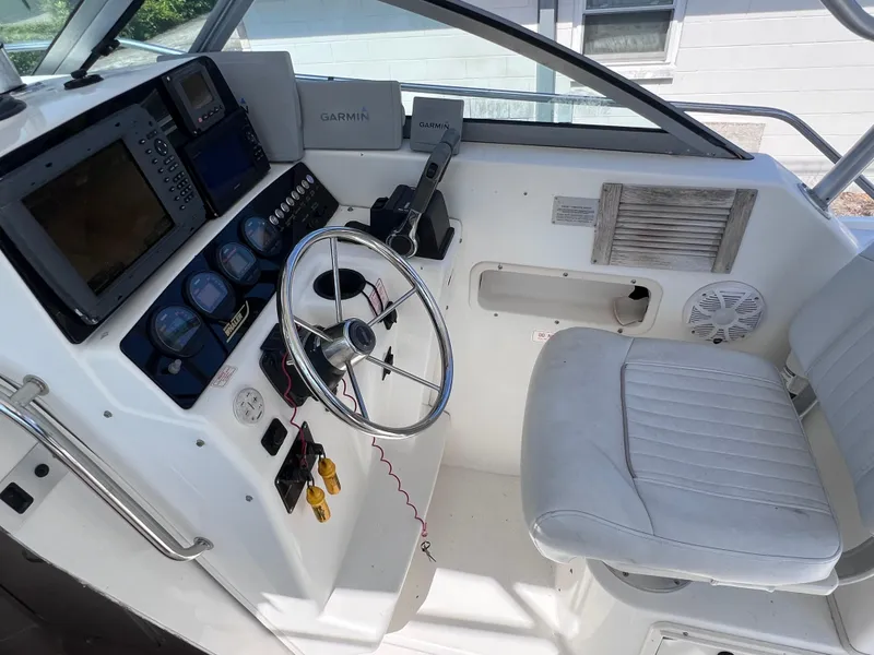 Slide: The Image of Helm of 2000 Boston Whaler 28 Conquest with Garmin navigation system. - 22