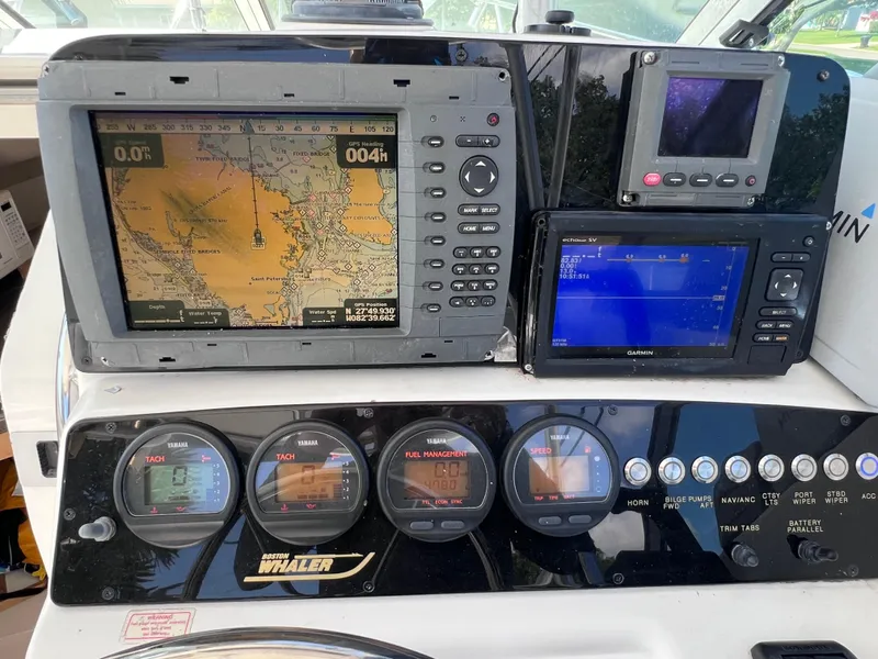 Slide: The Image of Dashboard of a 2000 Boston Whaler 28 Conquest with navigation and control instruments. - 23