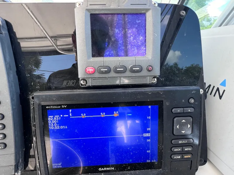 Slide: The Image of Garmin navigation system on a 2000 Boston Whaler 28 Conquest boat. - 25