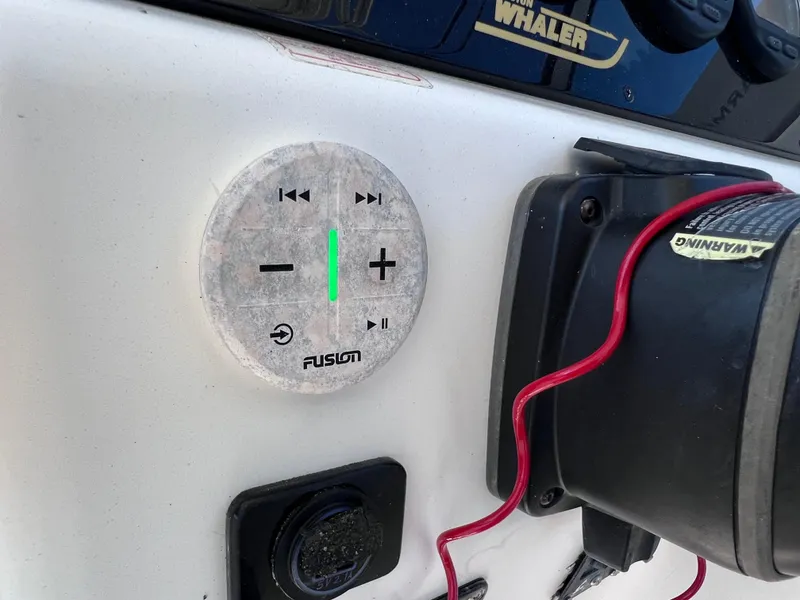 Slide: The Image of Fusion audio control panel on a 2000 Boston Whaler 28 Conquest boat. - 28