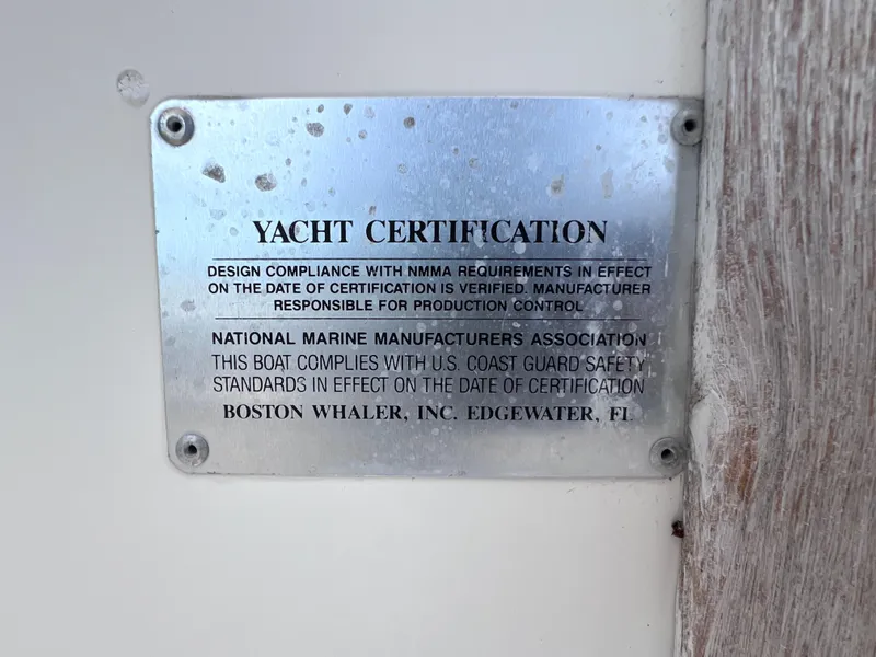 Slide: The Image of Yacht certification plaque on 2000 Boston Whaler 28 Conquest boat. - 30