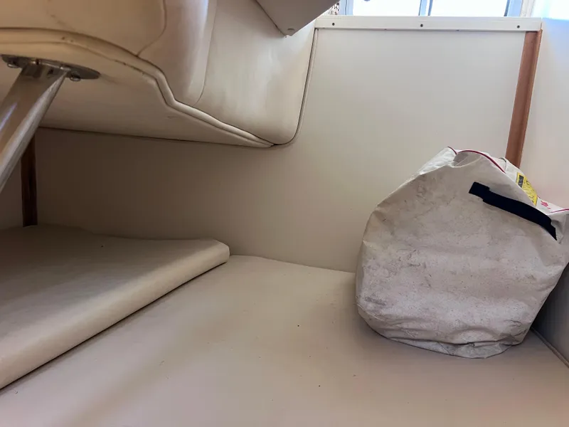 Slide: The Image of Interior cabin of a 2000 Boston Whaler 28 Conquest boat with storage bag. - 37