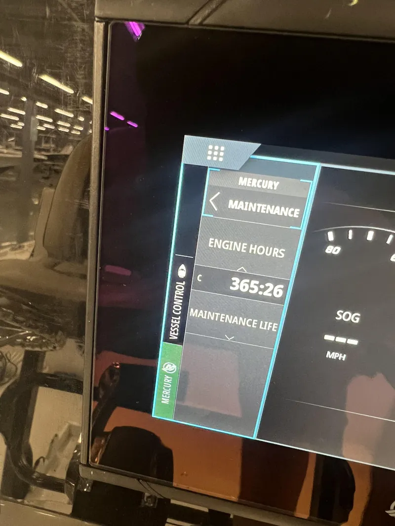 Slide: The Image of Mercury engine maintenance display showing 365:26 engine hours on a 2021 Tidewater 2500 Carolina Bay. - 13