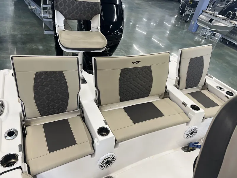 Slide: The Image of 2021 Tidewater 2500 Carolina Bay boat seats with cup holders and speakers. - 14
