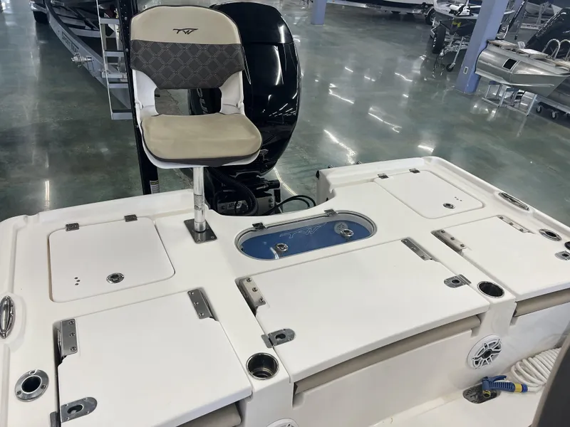 Slide: The Image of 2021 Tidewater 2500 Carolina Bay boat interior with seating and storage compartments. - 15