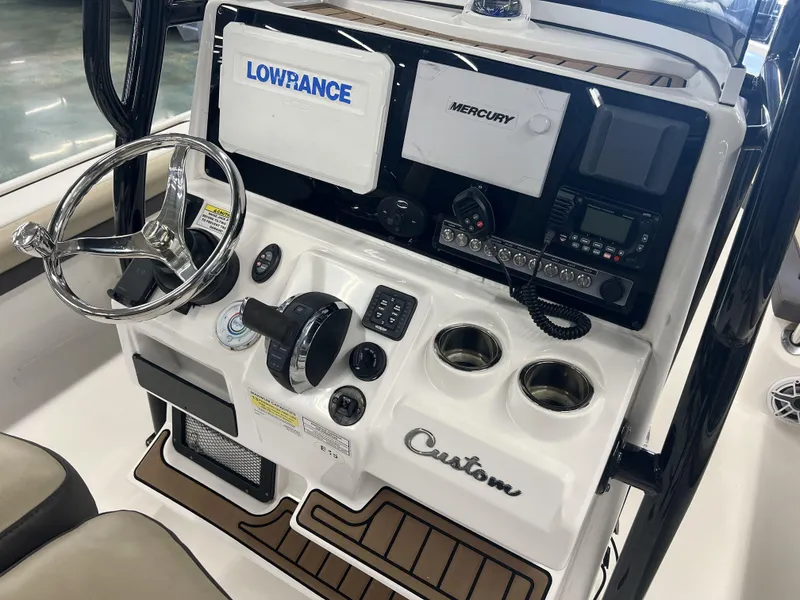 Slide: The Image of 2021 Tidewater 2500 Carolina Bay boat console with Lowrance and Mercury electronics. - 16