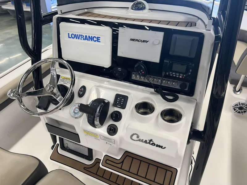 Slide: The Image of 2021 Tidewater 2500 Carolina Bay boat console with Lowrance and Mercury electronics. - 17