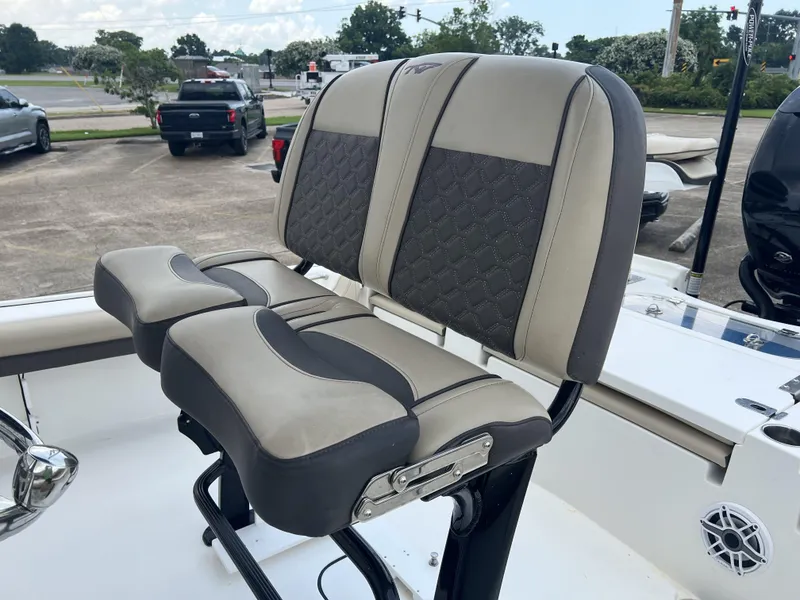 Slide: The Image of 2021 Tidewater 2500 Carolina Bay boat seating with cushioned backrests and armrests. - 6