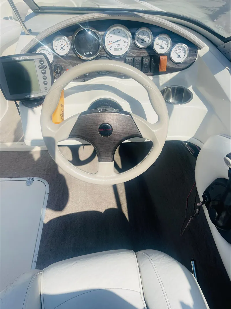 Slide: The Image of 2005 Stingray 195 LS/LX/LR boat dashboard with steering wheel and gauges. - 6