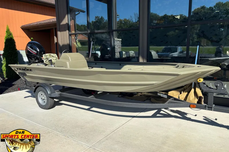 The Image of 2024 Tracker Grizzly 1754 SC boat on trailer, displayed outdoors at D&R Sports Center. - 0