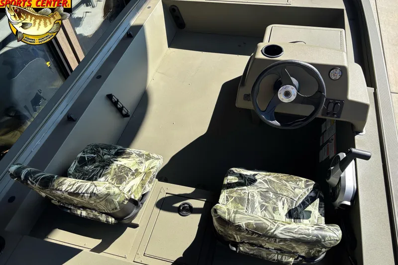 Slide: The Image of 2024 Tracker Grizzly 1754 SC boat interior with camo seats and steering console. - 3