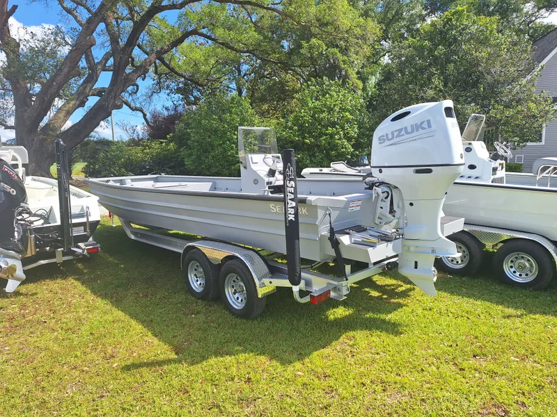 The Image of 2024 SeaArk 2472 CUB boat with Suzuki outboard motor on trailer. - 1