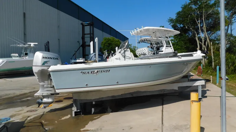 Slide: The Image of 2006 Sailfish 1900 boat with Honda outboard motor on a lift. - 0