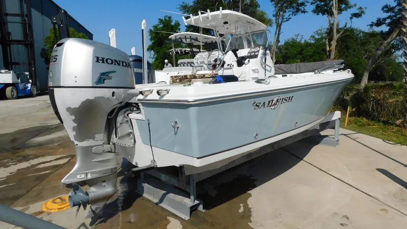 Slide: The Image of 2006 Sailfish 1900 boat with Honda outboard motor on a trailer. - 2