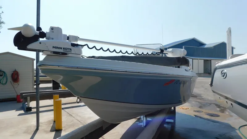 Slide: The Image of 2006 Sailfish 1900 boat with Minn Kota trolling motor in a marina. - 3