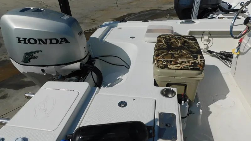 Slide: The Image of 2006 Sailfish 1900 boat with Honda outboard motor and camo seat cushion. - 6