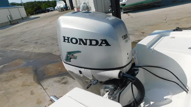 Slide: The Image of Honda 135 outboard motor on a 2006 Sailfish 1900 boat. - 7