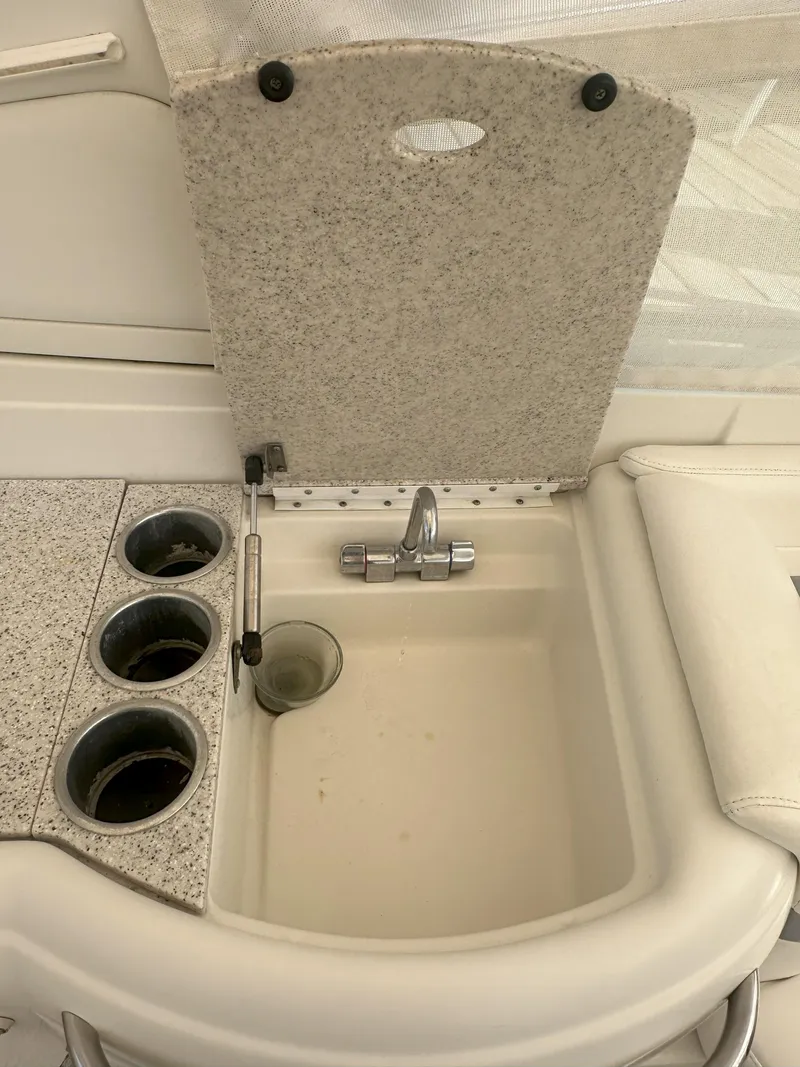 Slide: The Image of 2004 Formula 330 SS boat sink and countertop with cup holders. - 15