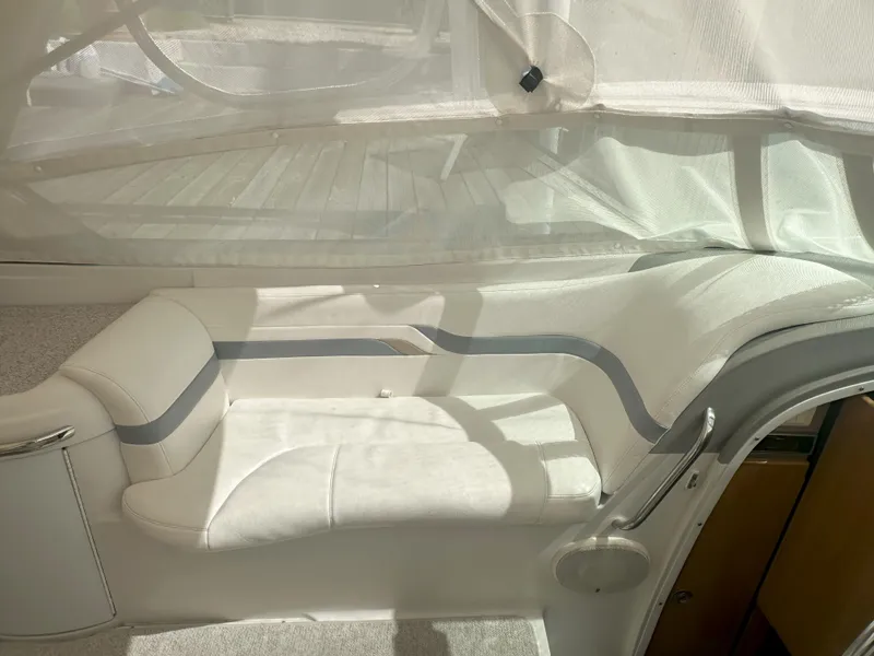 Slide: The Image of Interior seating of a 2004 Formula 330 SS boat with white upholstery. - 20