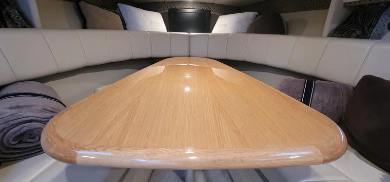 Slide: The Image of Interior cabin of a 2004 Formula 330 SS boat with a wooden table. - 24