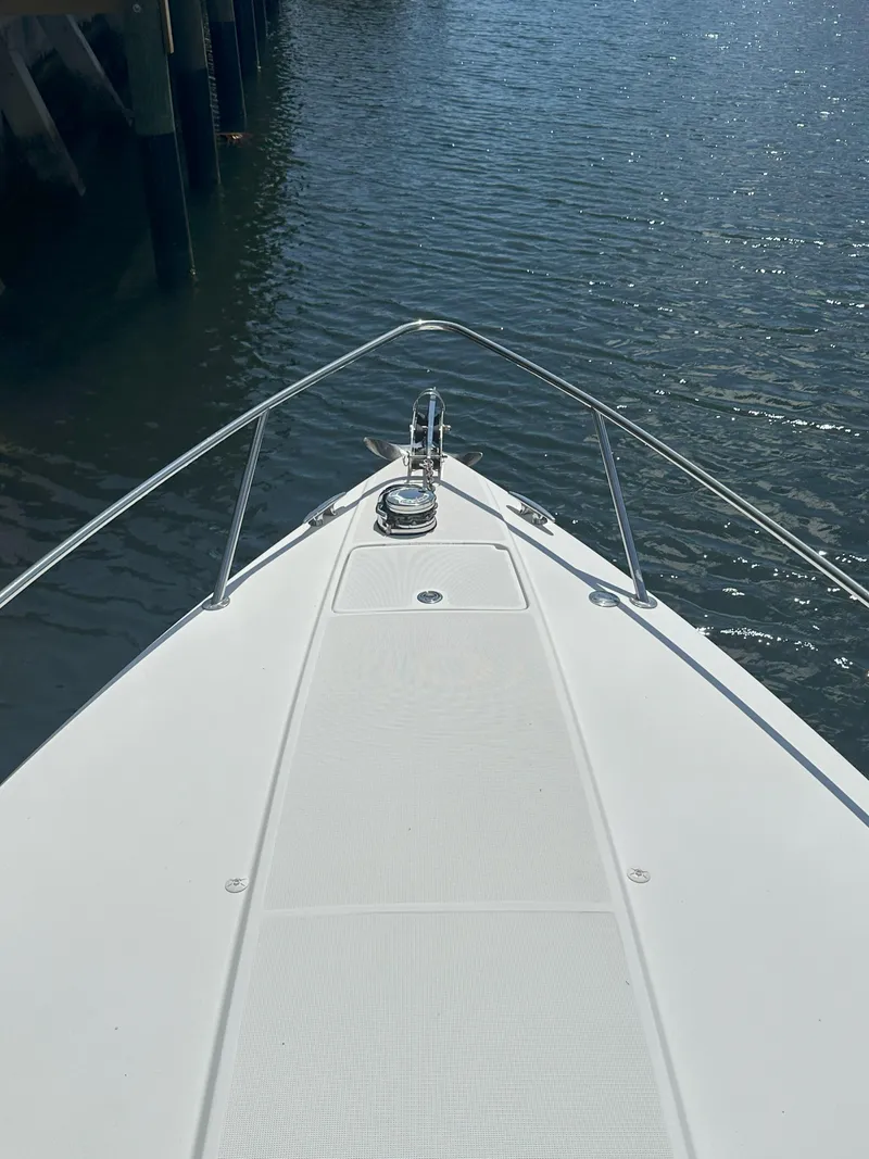 Slide: The Image of Bow of 2004 Formula 330 SS boat on calm water. - 4