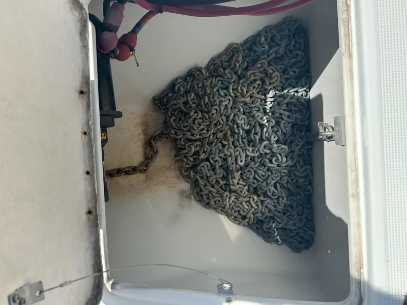 Slide: The Image of Anchor chain storage compartment of a 2004 Formula 330 SS boat. - 6