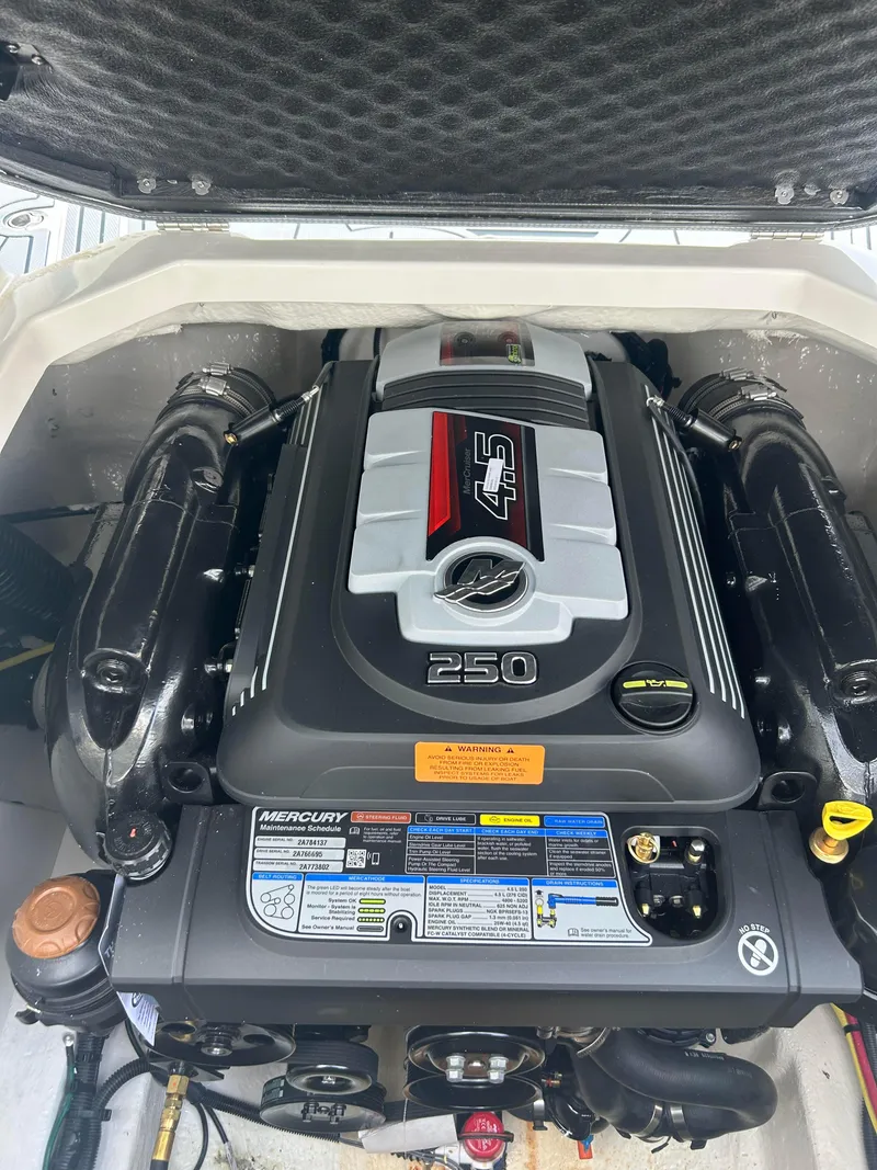 Slide: The Image of 2024 Chaparral 21 Surf boat engine compartment with a powerful 4.5L 250 HP Mercury engine. - 5