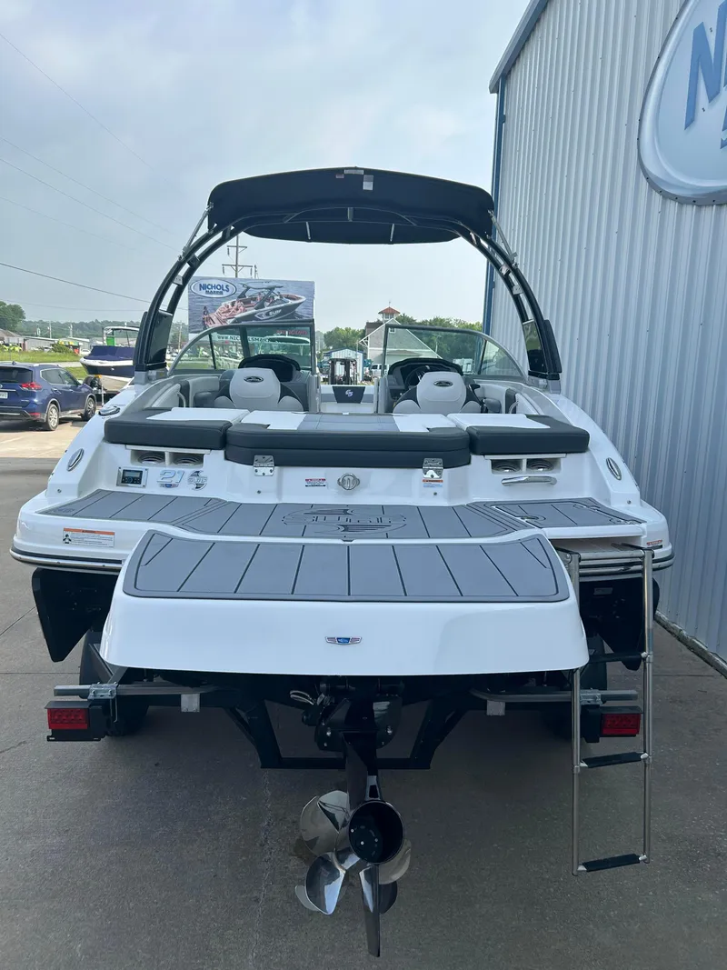 Slide: The Image of 2024 Chaparral 21 Surf boat, rear view, docked at marina. - 6