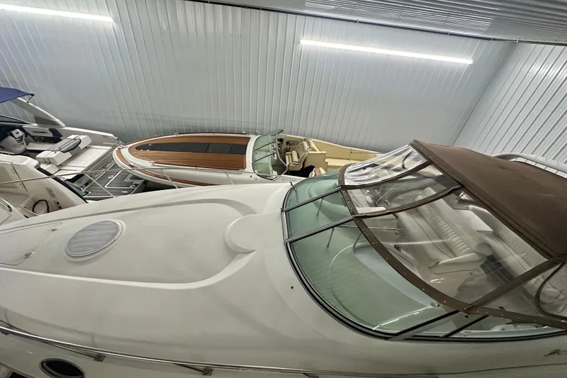 Slide: The Image of 1998 Cruisers Yachts 3075 Rogue in storage, showcasing sleek design and spacious interior. - 15