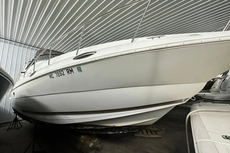 Slide: The Image of 1998 Cruisers Yachts 3075 Rogue boat in storage, side view. - 19