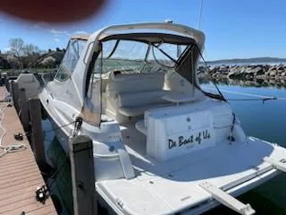 Slide: The Image of 1998 Cruisers Yachts 3075 Rogue docked at marina, rear view. - 2