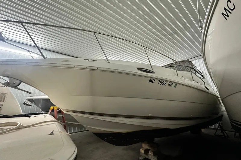 Slide: The Image of 1998 Cruisers Yachts 3075 Rogue boat stored indoors, side view. - 20